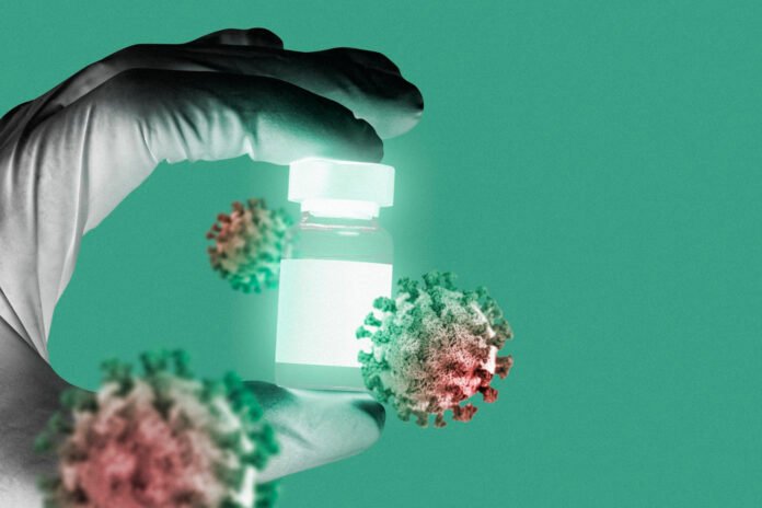 imagem de uma mão segurando um vidro de amostras com ícones de viris em primeiro plano.