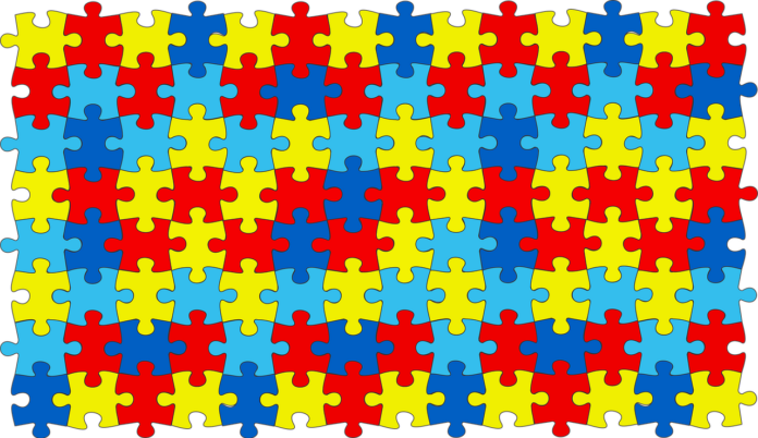 quebra cabeça com as cores do autismo.